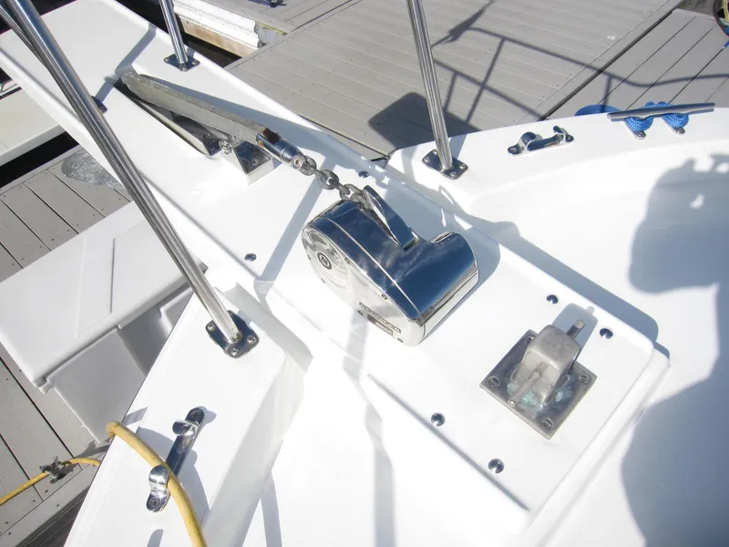 Slide: The Image of Deck of 1990 Blue Seas 31 Hardtop Cruiser with anchor winch and cleat. - 41