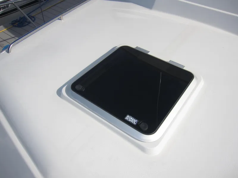 Slide: The Image of Deck hatch of a 1990 Blue Seas 31 Hardtop Cruiser. - 44