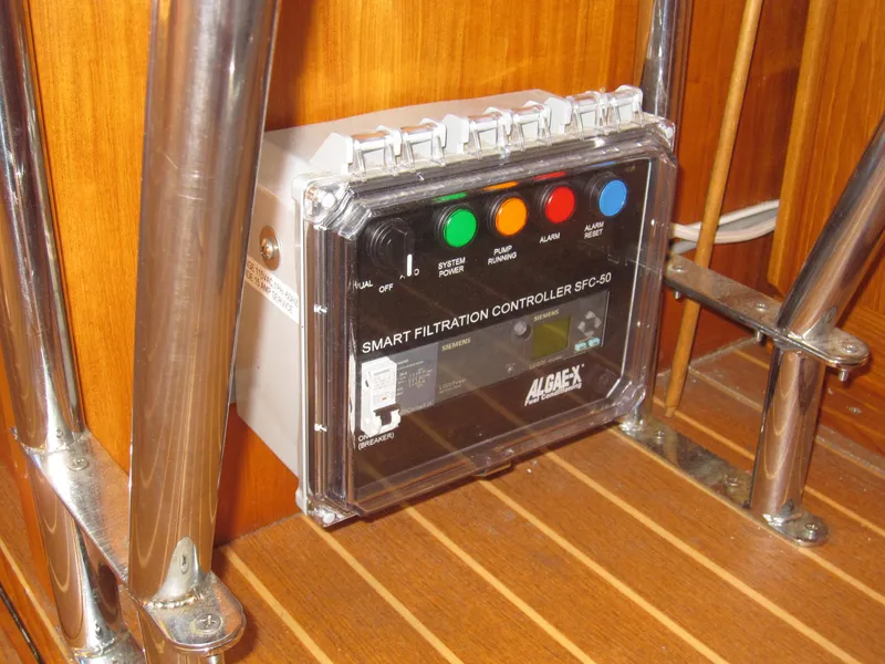 Slide: The Image of Smart filtration controller on 1990 Blue Seas 31 Hardtop Cruiser, mounted on wooden panel. - 46