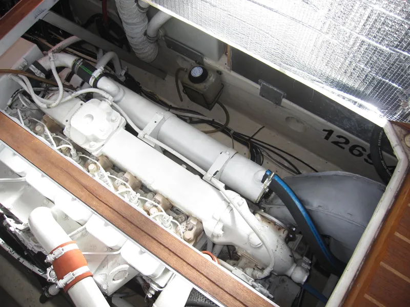 Slide: The Image of Engine compartment of a 1990 Blue Seas 31 Hardtop Cruiser, showcasing mechanical components. - 47