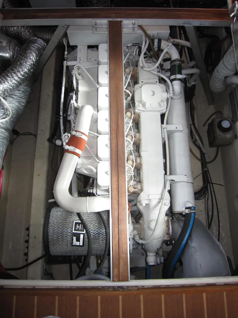 Slide: The Image of Engine compartment of a 1990 Blue Seas 31 Hardtop Cruiser, showcasing detailed mechanical components. - 48