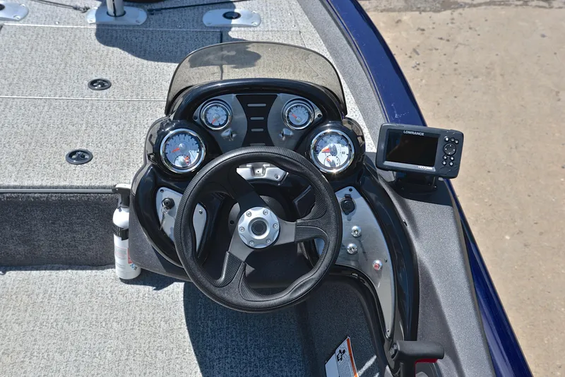 Slide: The Image of 2021 Bass Tracker PRO TEAM 175 TF boat dashboard with steering wheel and gauges. - 23