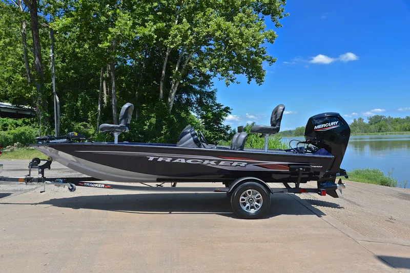 Slide: The Image of 2021 Bass Tracker PRO TEAM 175 TF fishing boat on trailer by a lake. - 11
