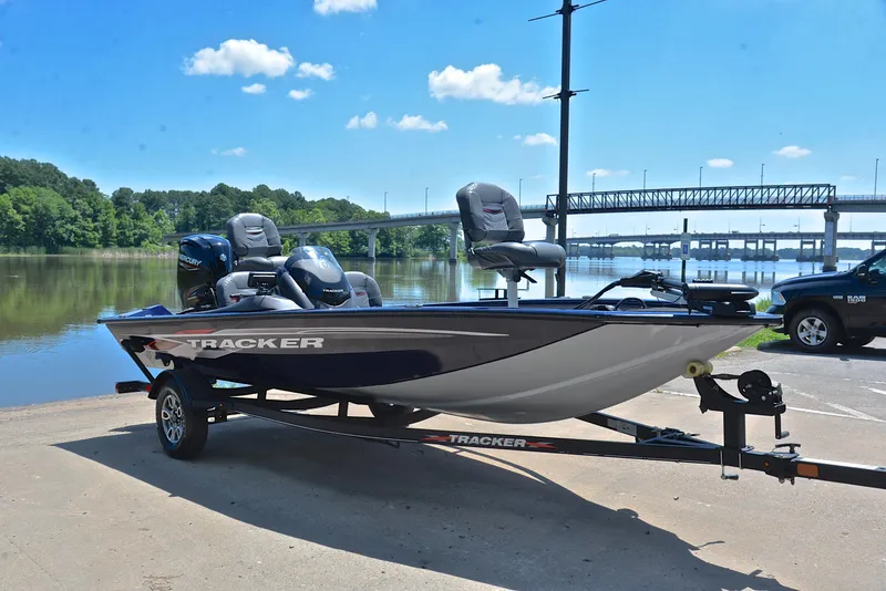 Slide: The Image of 2021 Bass Tracker PRO TEAM 175 TF fishing boat on trailer by a lake. - 16
