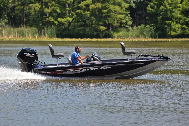 Slide: The Image of 2021 Bass Tracker PRO TEAM 175 TF boat cruising on a lake. - 3