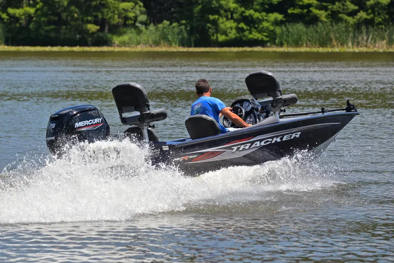 Slide: The Image of 2021 Bass Tracker PRO TEAM 175 TF boat on a lake with Mercury engine. - 5