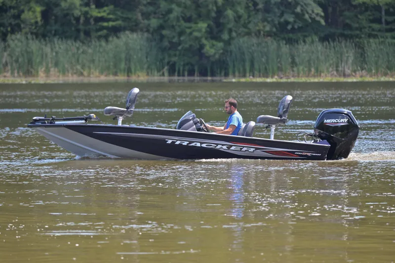 Slide: The Image of 2021 Bass Tracker PRO TEAM 175 TF boat on a lake. - 9