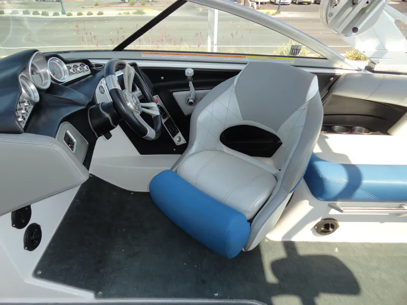 Slide: The Image of 2013 MasterCraft X-10 boat interior with steering wheel and captain's chair. - 12