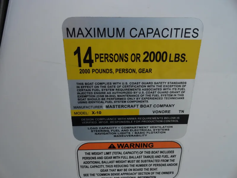 Slide: The Image of 2013 MasterCraft X-10 boat capacity label: 14 persons or 2000 lbs. - 14
