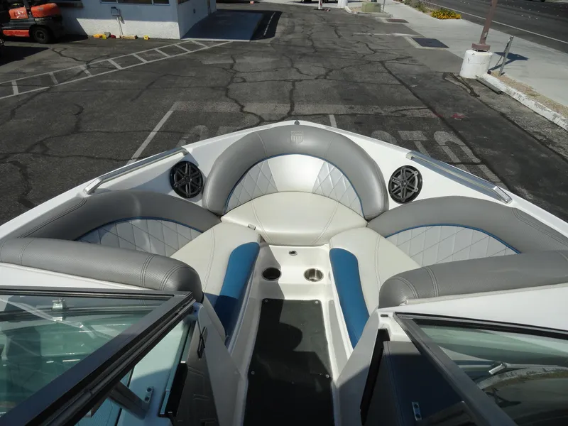 Slide: The Image of 2013 MasterCraft X-10 boat interior with gray and blue seating. - 17