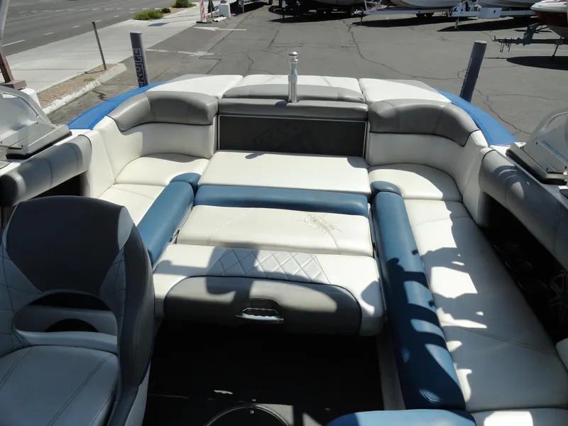 Slide: The Image of 2013 MasterCraft X-10 boat interior with white and blue seating. - 20
