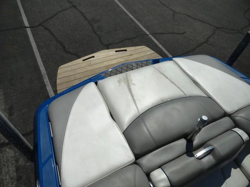 Slide: The Image of 2013 MasterCraft X-10 boat interior with gray and white seating. - 21