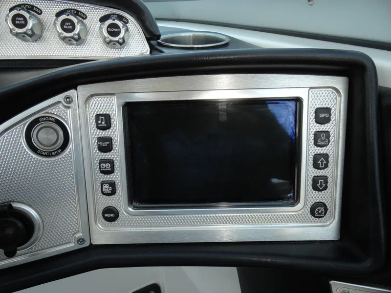 Slide: The Image of 2013 MasterCraft X-10 boat dashboard with touchscreen display and control buttons. - 9