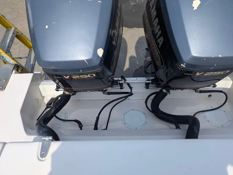 Slide: The Image of Twin Yamaha V250 outboard engines on a 2000 Grady-White Bimini 306 boat. - 15