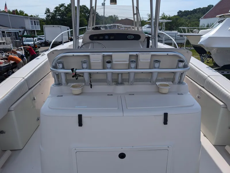 Slide: The Image of 2000 Grady-White Bimini 306 boat interior with rod holders and storage compartments. - 17
