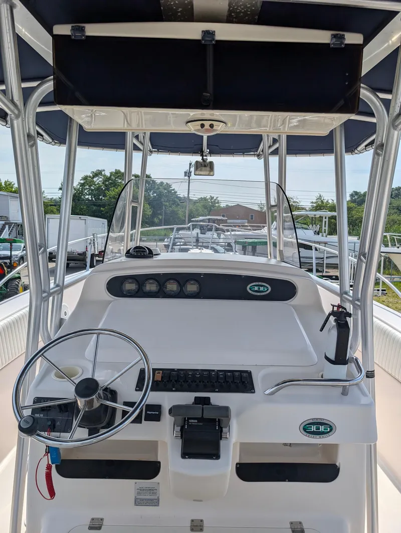 Slide: The Image of Grady-White Bimini 306, 2000 model, boat cockpit with steering wheel and control panel. - 20