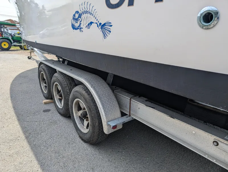 Slide: The Image of Grady-White Bimini 306 boat on a triple-axle trailer, side view, 2000 model. - 26