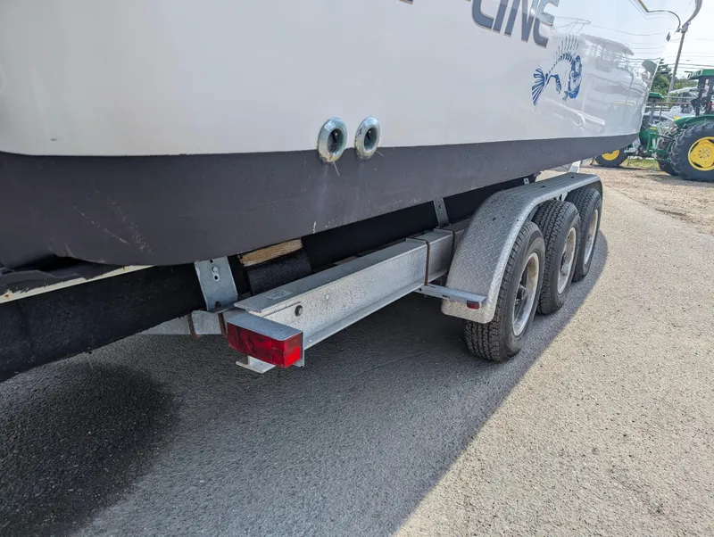 Slide: The Image of Grady-White Bimini 306 boat on a triple-axle trailer, 2000 model. - 28