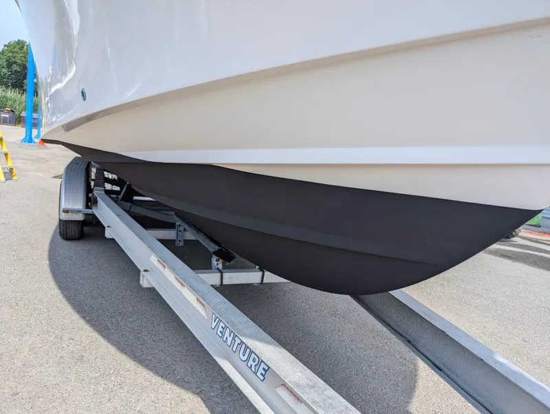 Slide: The Image of Grady-White Bimini 306 (2000) boat on Venture trailer, close-up of hull. - 29