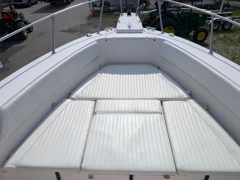 Slide: The Image of 2000 Grady-White Bimini 306 boat with spacious cushioned seating area. - 8