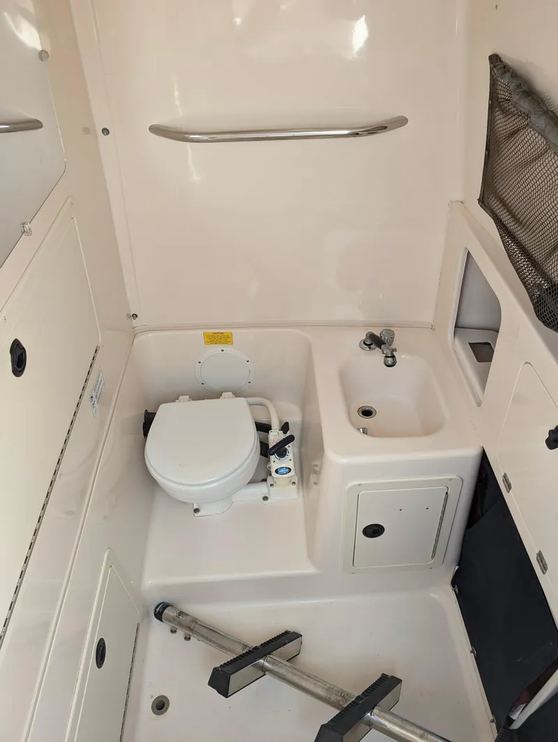 Slide: The Image of 2000 Grady-White Bimini 306 boat bathroom with toilet and sink - 9