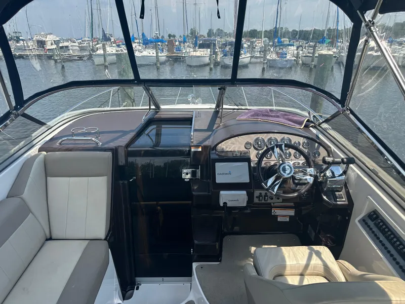 Slide: The Image of Cockpit view of 2014 Regal 30 Express boat docked at marina. - 10