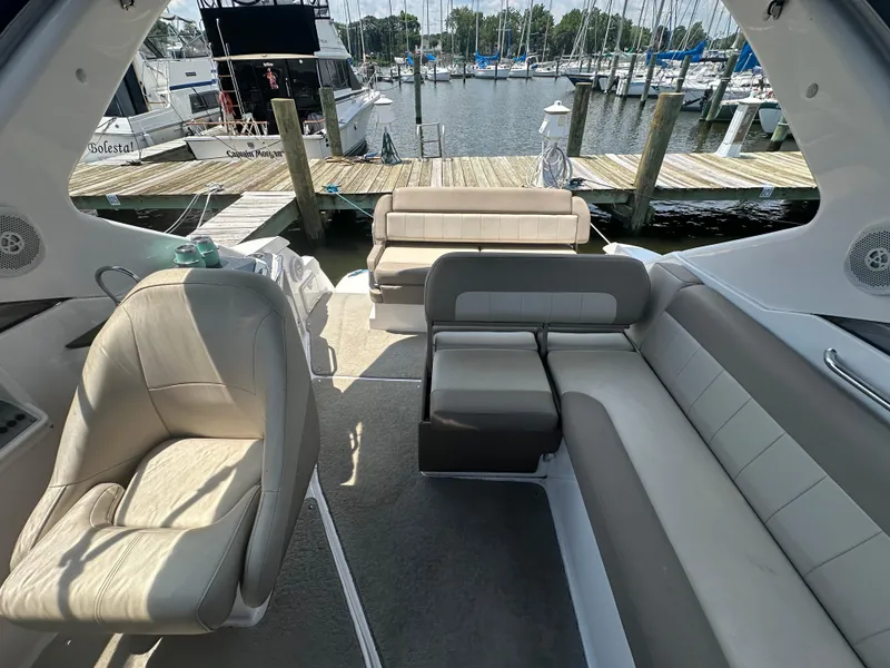 Slide: The Image of 2014 Regal 30 Express boat interior with seating, docked at marina. - 15