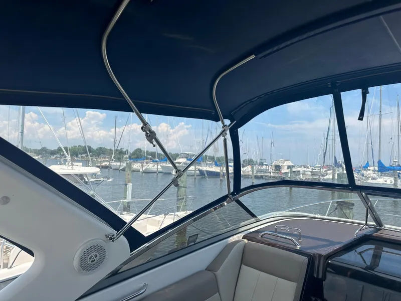 Slide: The Image of Interior view of 2014 Regal 30 Express boat with marina in background. - 18