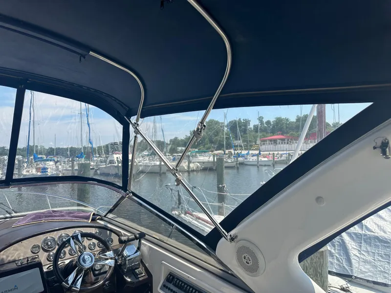 Slide: The Image of Interior view of 2014 Regal 30 Express boat at marina. - 20