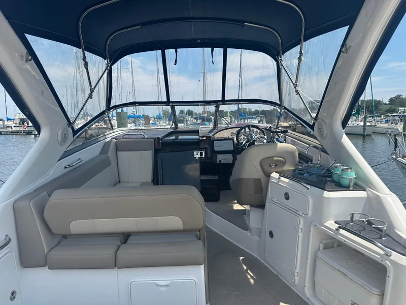 Slide: The Image of 2014 Regal 30 Express boat interior with seating and helm station. - 5