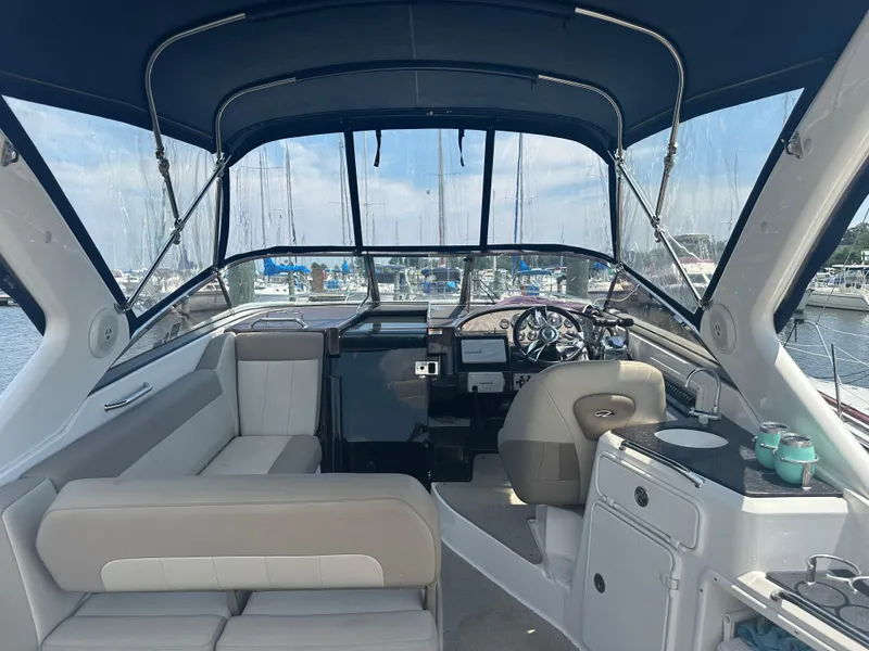 Slide: The Image of Interior of a 2014 Regal 30 Express boat with seating and helm station. - 6