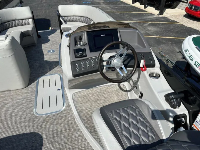 Slide: The Image of 2021 Bennington 23RFBSD boat interior with steering wheel and control panel. - 3