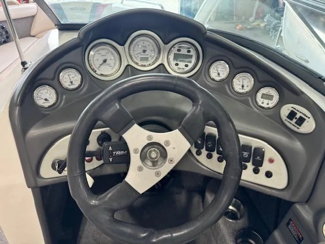 Slide: The Image of 2007 Moomba Mobius LSV boat dashboard with steering wheel and gauges. - 5