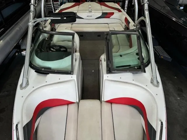Slide: The Image of 2007 Moomba Mobius LSV boat interior with white and red seating. - 9