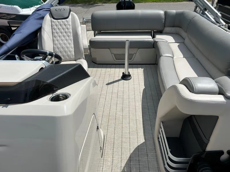 Slide: The Image of 2019 Harris Grand Mariner 250 boat interior with luxurious seating and modern design. - 5