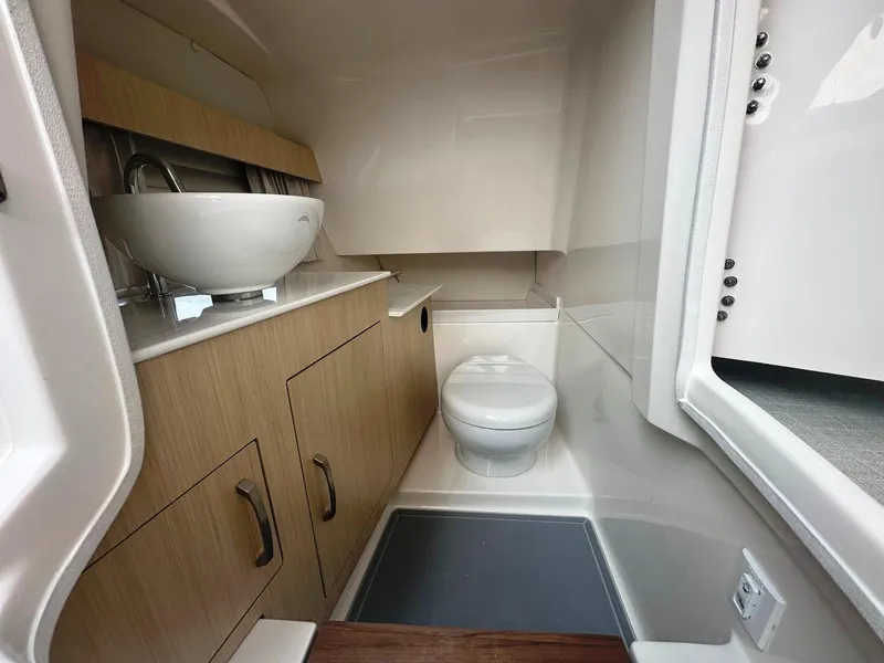 Slide: The Image of Modern bathroom in 2025 Regal 3300 boat with sink and toilet. - 14
