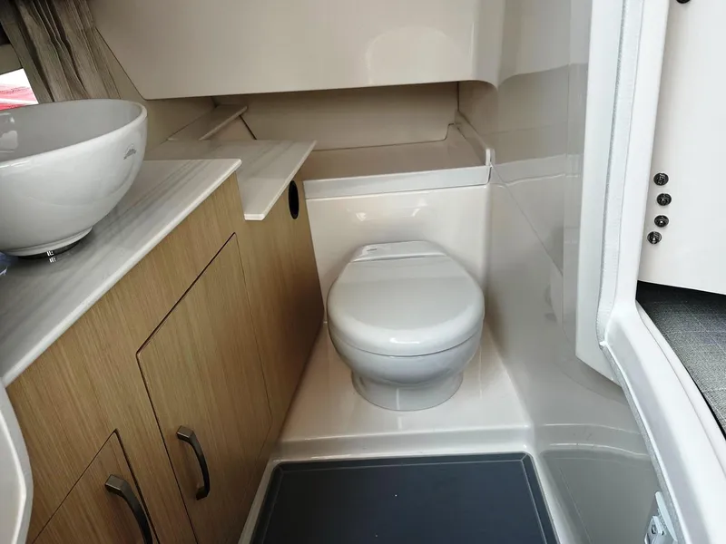Slide: The Image of Modern bathroom in 2025 Regal 3300 boat with toilet and sink. - 15