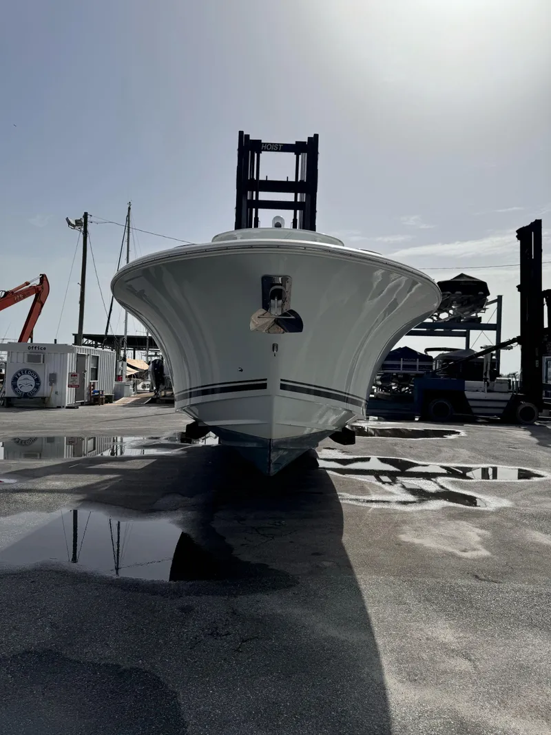 Slide: The Image of A 2015 Southport 33 boat on a dry dock, surrounded by equipment. - 6
