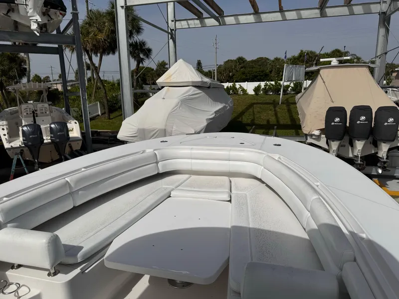 Slide: The Image of 2015 Southport 33 boat with white seating and covered boats in the background. - 4