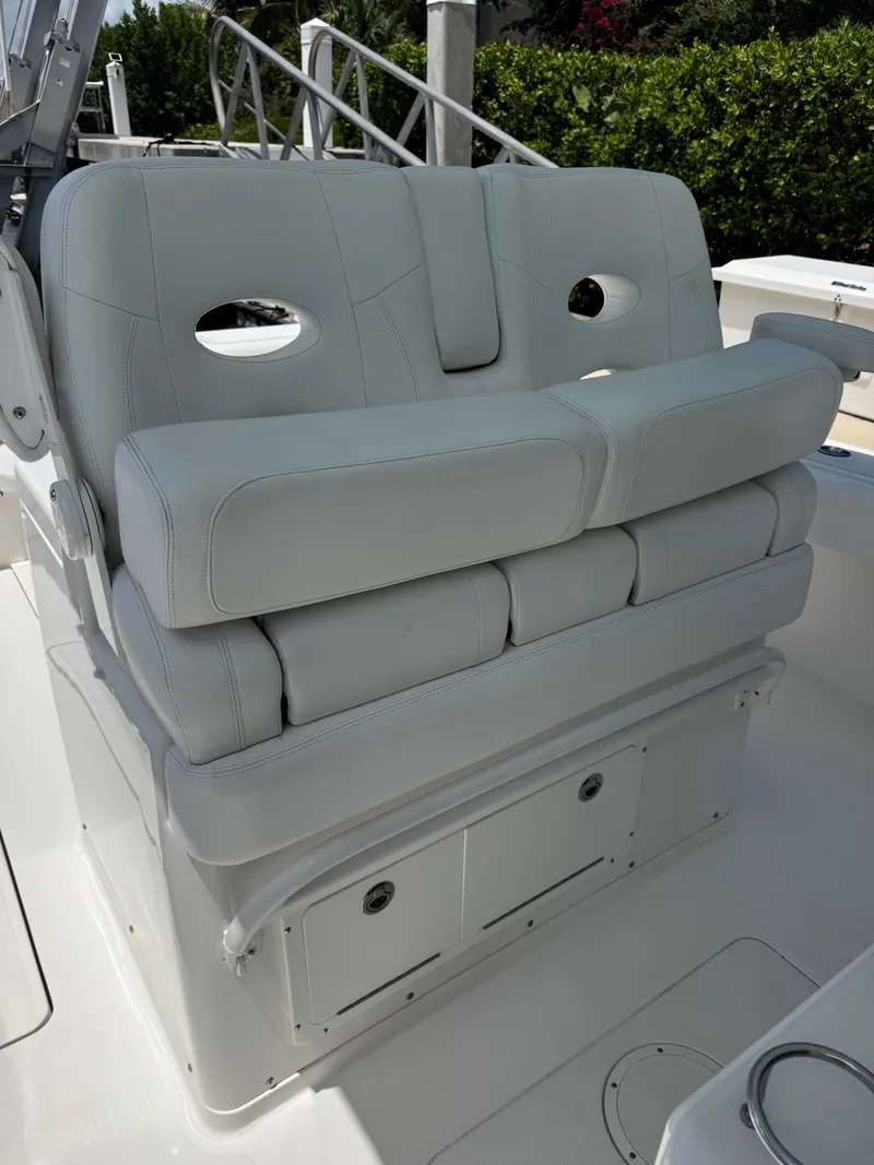 Slide: The Image of The 2015 Southport 33 features a cushioned bench seat with storage underneath. - 23
