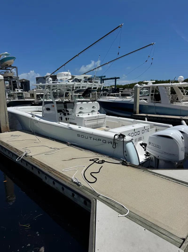 Slide: The Image of 2015 Southport 33 at dock with twin outboard engines. - 31