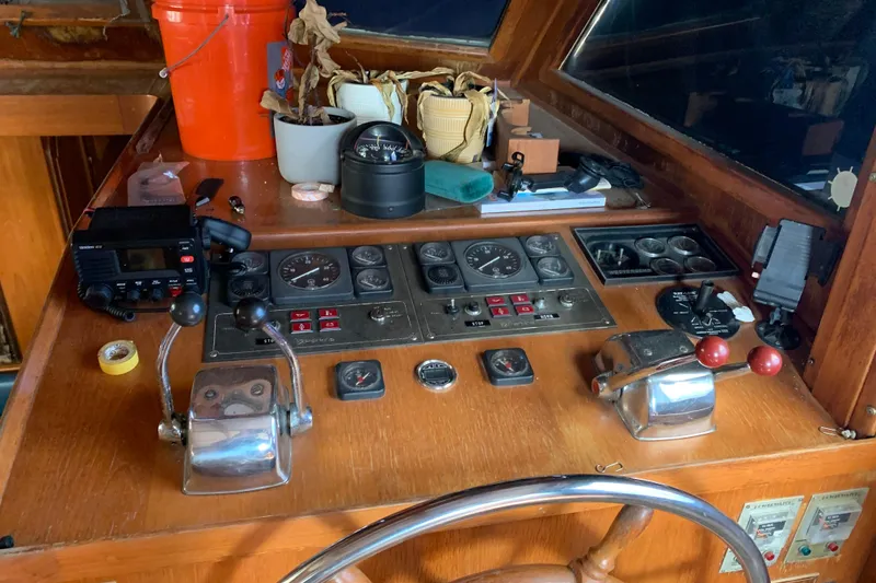 Slide: The Image of Control panel of a 1984 Jefferson 45 Motor Yacht with various instruments and controls. - 10