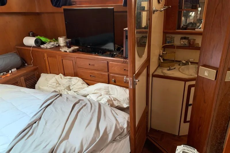 Slide: The Image of Interior of 1984 Jefferson 45 Motor Yacht with bedroom and compact bathroom. - 14