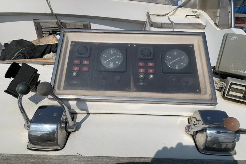 Slide: The Image of Control panel of a 1984 Jefferson 45 Motor Yacht with gauges and levers. - 5