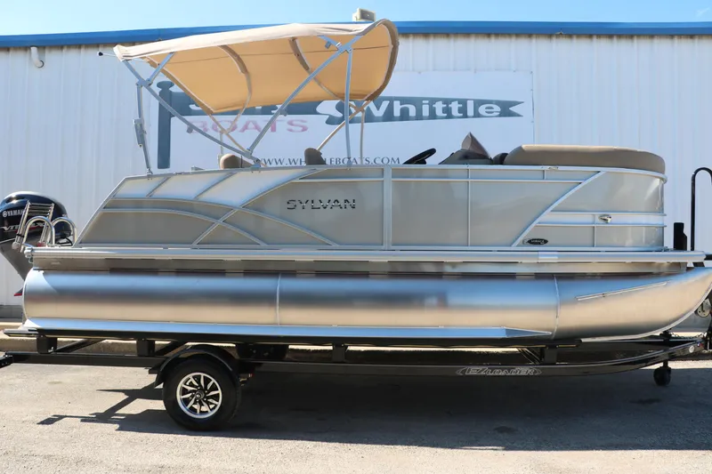Slide: The Image of 2025 Sylvan Mirage 820 CLZ DH pontoon boat with canopy on trailer. - 13