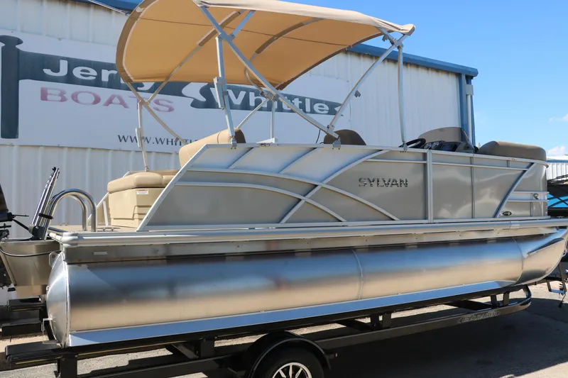 Slide: The Image of 2025 Sylvan Mirage 820 CLZ DH pontoon boat with canopy on trailer. - 14