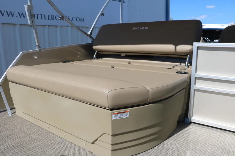 Slide: The Image of Sylvan Mirage 820 CLZ DH 2025 boat with tan seating and storage compartment. - 19