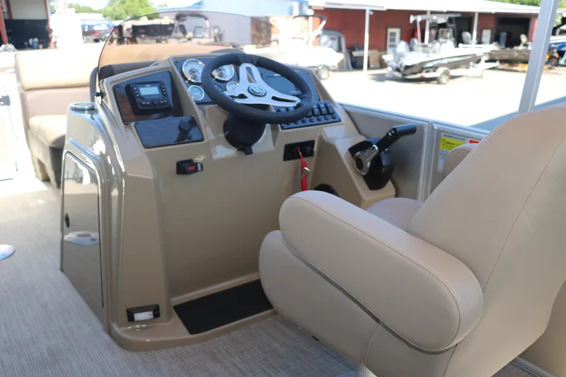 Slide: The Image of 2025 Sylvan Mirage 820 CLZ DH boat cockpit with steering wheel and control panel. - 23
