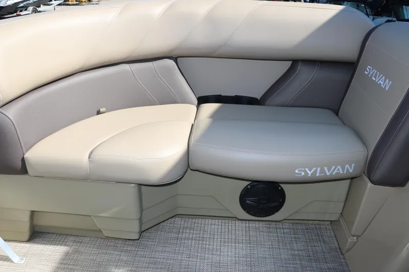 Slide: The Image of 2025 Sylvan Mirage 820 CLZ DH boat interior seating with beige upholstery. - 27