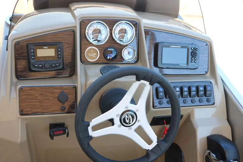 Slide: The Image of Dashboard of 2025 Sylvan Mirage 820 CLZ DH with steering wheel and control panels. - 28